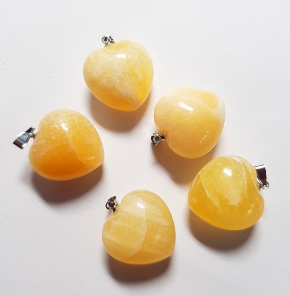 Yellow calcite heart pendant at Cristalljoia Barcelona