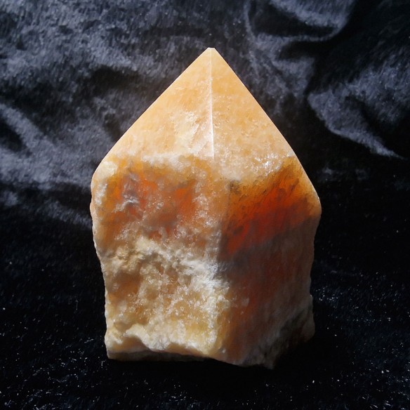 Yellow calcite obsidian polished point at Cristalljoia Barcelona