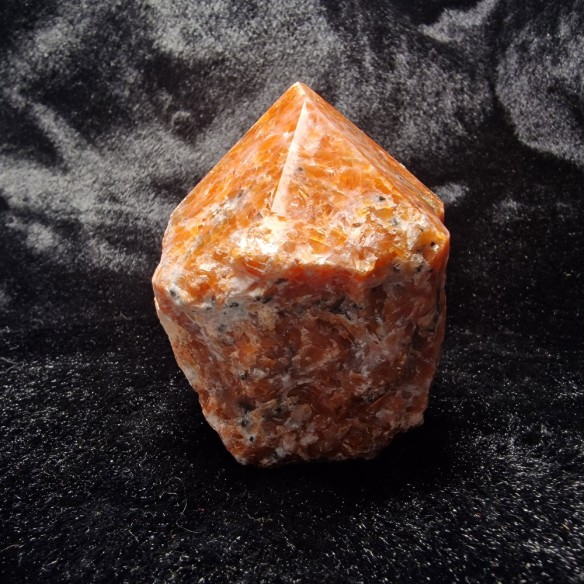 Orchid calcite polished point at Cristalljoia Barcelona