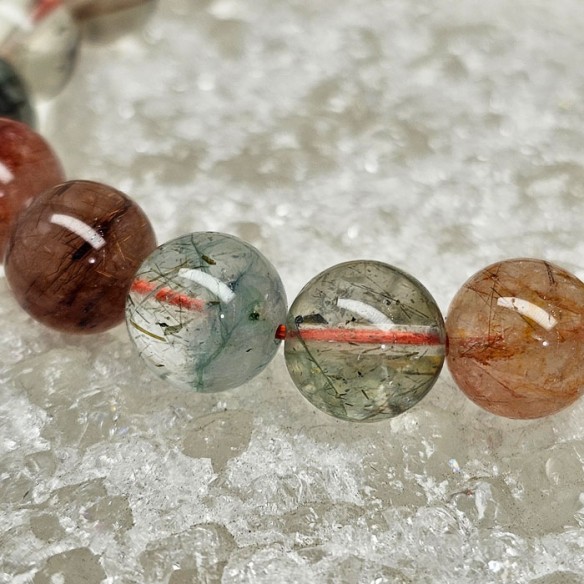 Pulsera de bolas de 10 mm de cuarzos rutilados variados 
