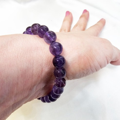 Pulsera de bola de amatista de 10mm. Elegancia mineral