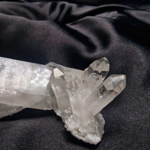 Abundance master quartz. Small druse with elongated crystal