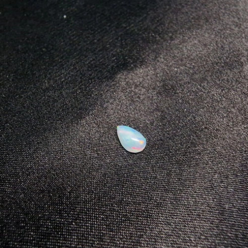 Teardrop cabochon Australian opal. The rainbow in stone.