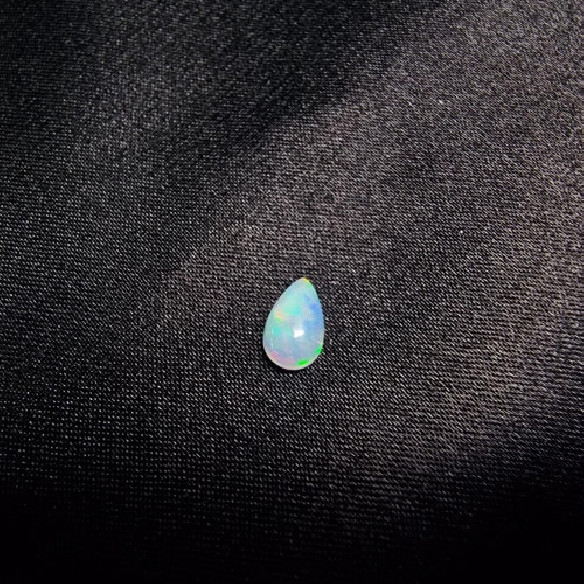 Teardrop cabochon Australian opal. The rainbow in stone.
