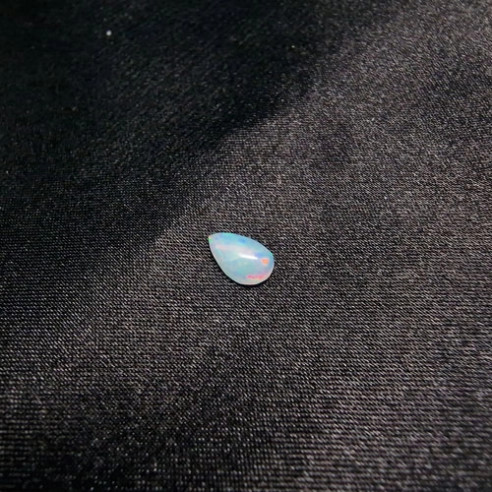 Teardrop cabochon Australian opal. The rainbow in stone.