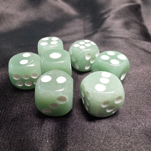 Green aventurine die flowing in harmony and well-being