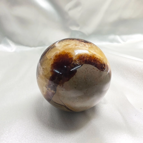 Septarian sphere. Cracks formed over time by the Earth
