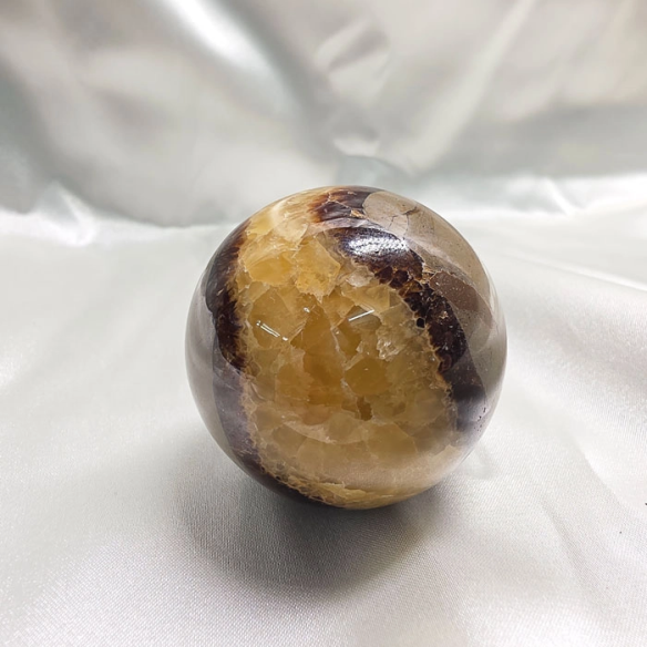 Septarian sphere. Cracks formed over time by the Earth