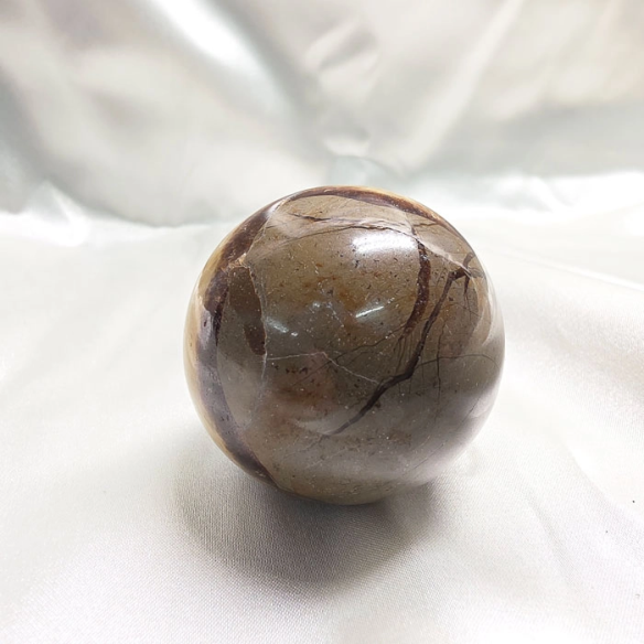 Septarian sphere. Cracks formed over time by the Earth