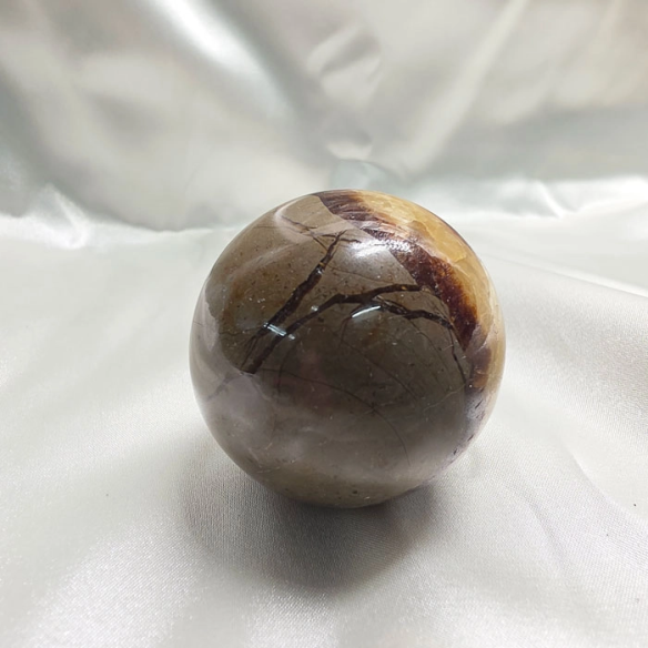Septarian sphere. Cracks formed over time by the Earth