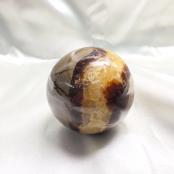 Septarian sphere. Cracks formed over time by the Earth