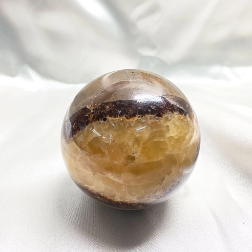 Septarian sphere. Cracks formed over time by the Earth