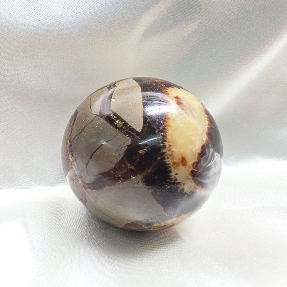 Septarian sphere. Cracks formed over time by the Earth