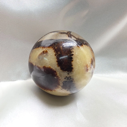 Septarian sphere. Cracks formed over time by the Earth