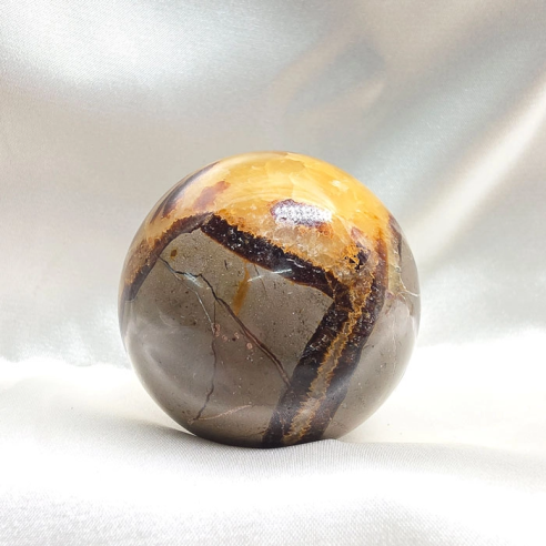 Septarian sphere. Cracks formed over time by the Earth