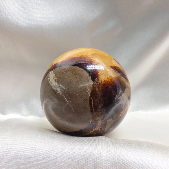 Septarian sphere. Cracks formed over time by the Earth