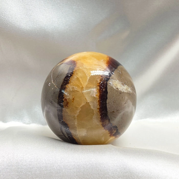 Septarian sphere. Cracks formed over time by the Earth