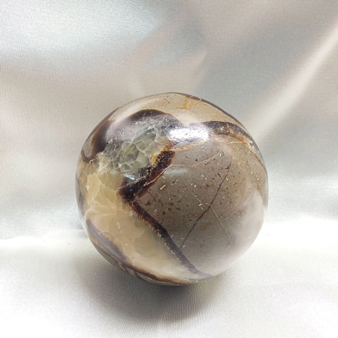 Septarian sphere. Cracks formed over time by the Earth