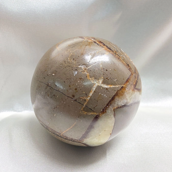 Septarian sphere. Cracks formed over time by the Earth