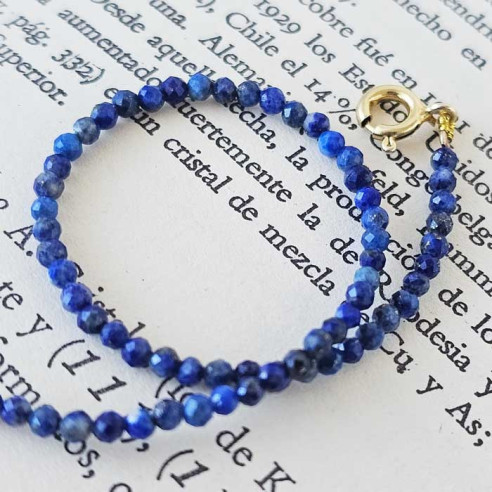Macro of faceted beads of genuine lapis lazuli on Treatise on Mineralogy
